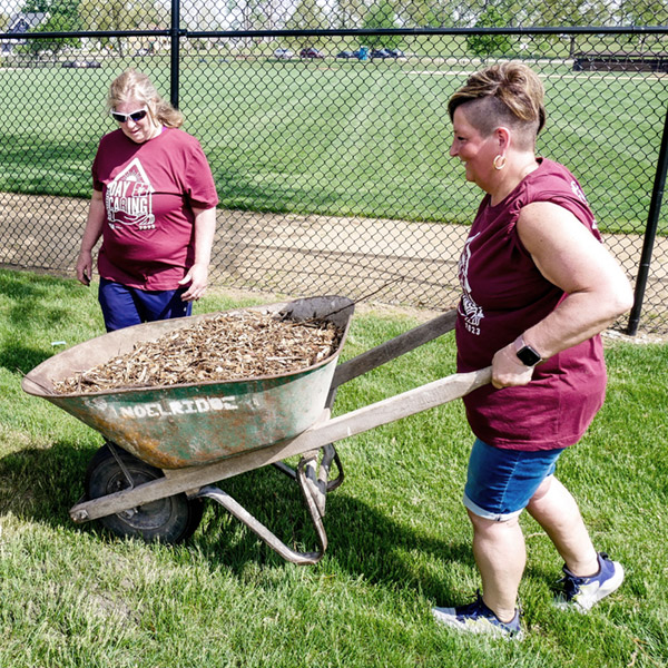 Volunteers with Wheelbarrow